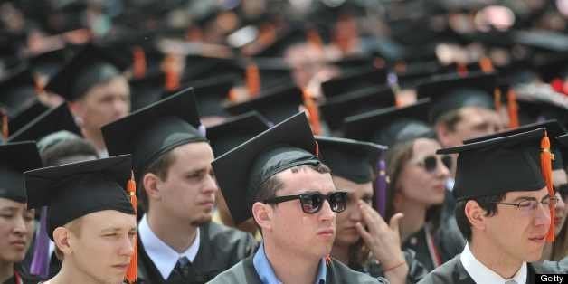 Graduating students are seen during the commencement ceremony at Ohio State University on May 5, 2013 in Columbus, Ohio. US President Barack Obama gave the commencement address. AFP PHOTO/Mandel NGAN (Photo credit should read MANDEL NGAN/AFP/Getty Images)