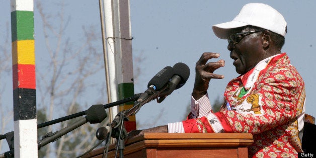 Zimbabwe President and Zanu PF presidential candidate Robert Mugabe speaks at a election campaign rally in Chinhoyi in Mashonaland Weston July 18, 2013. AFP PHOTO/ Jekesai Njikizana. (Photo credit should read JEKESAI NJIKIZANA/AFP/Getty Images)