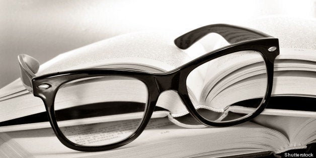 a pile of books and glasses...