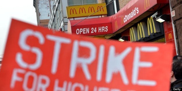 A coalition of groups rally in front of a McDonald's on East 125th Street and Lexington Avenue in Harlem during a protest by