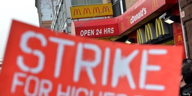 A coalition of groups rally in front of a McDonald's on East 125th Street and Lexington Avenue in Harlem during a protest by fast food workers and supporters for higher wages April 4, 2013 in New York. The protest was held on the 45th anniversary of the assasination of civil rights leader Martin Luther King, Jr. AFP PHOTO/Stan HONDA (Photo credit should read STAN HONDA/AFP/Getty Images)