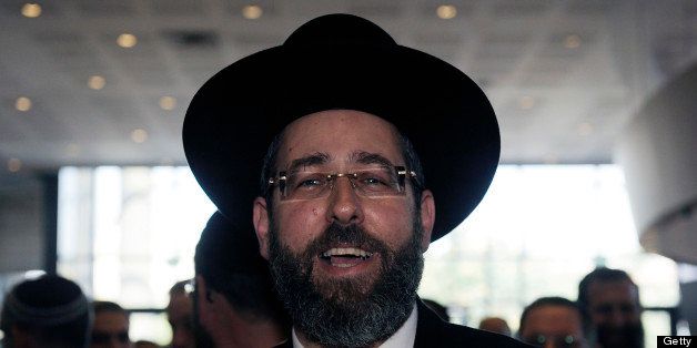 Newly-elected Ashkenazi Chief Rabbi of Israel, David Lau poses after the election in Jerusalem on July 24, 2013. Israel has two chief rabbis, the Ashkenazi and Sephardi, whose responsibilities include the country's rabbinical courts and regulating the food supervision industry. AFP PHOTO/DAVID BUIMOVITCH (Photo credit should read DAVID BUIMOVITCH/AFP/Getty Images)