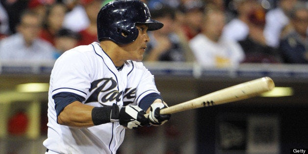 SAN DIEGO, CA - JULY 29: Everth Cabrera #2 of the San Diego Padres hits a single during the third inning of a baseball game against the Cincinnati Reds at Petco Park on July 29, 2013 in San Diego, California. (Photo by Denis Poroy/Getty Images)