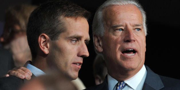 Democratic vice presidential nominee Sen. Joe Biden (R) is seen with his son Beau Biden at the Democratic National Convention 2008 at the Pepsi Center in Denver, Colorado, on August 25, 2008. The Democrats formally opened their convention to crown Barack Obama as the first black presidential election nominee. The DNC is held 25-28 August. AFP PHOTO Paul J. RICHARDS (Photo credit should read PAUL J. RICHARDS/AFP/Getty Images)