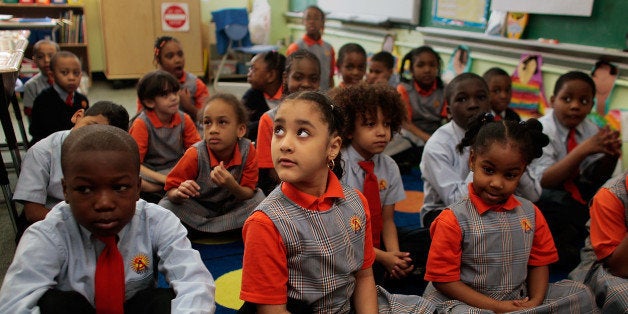 NEW YORK - MARCH 30: Students (L to R, front row) Lamine Cisse, Marjery Pacheco, and Mia McNair sit quietly and wait for their teacher at Harlem Success Academy, a free, public elementary charter school March 30, 2009 in the Harlem neighborhood of New York City. All students at the charter school are required to wear uniforms. The charter school emphasizes classes like science, geography, and social studies, as well as instruction in chess, art, and dance. President Obama recently called for a lifting of the caps currently in place that limit charter schools expansion, which in New York often share school building space with regular public schools. Currently 115 charter schools operate in the state of New York, over half of them in New York City, with 30 more approved to open in the next 18 months. (Photo by Chris Hondros/Getty Images)