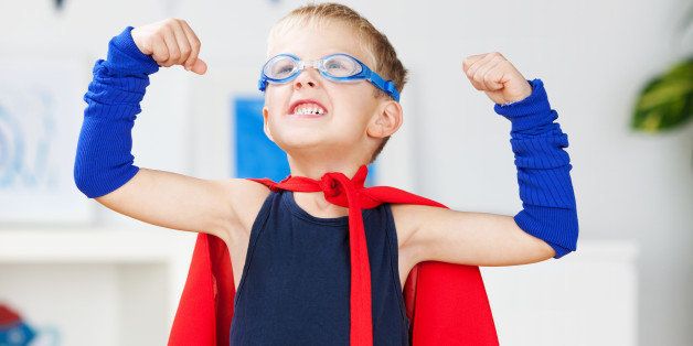 strong kid wearing a superhero...