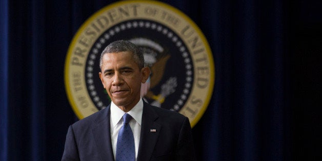 U.S. President Barack Obama arrives to speak in the South Court Auditorium of the Eisenhower Executive Building next to the W