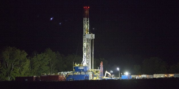 MONTOURSVILLE, PA - SEPTEMBER 8: Lights shine on a natural gas drilling rig September 8, 2012 near Montoursville, Pennsylvania. The area sits above the Marcellus Shale where the search for natural gas uses a controversial method known as hydrofracking. Hydrofracking involves pumping millions of gallons of water, sand and chemicals into horizontally drilled wells to stimulate the release of the gas. The Marcellus Shale gas field stretches diagonally across West Virginia, Ohio, Pennsylvania and New York State. Drilling operations have provided Pennsylvania with billions of dollars of income through employment and tax revenue. The environmental impact is a politically sensitive issue in a resource dependent state. (Photo by Robert Nickelsberg/Getty Images)