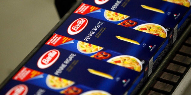 Boxes of packaged penne rigate pasta travel along the production line inside Barilla Holding SpA's factory in Parma, Italy, on Wednesday, Oct. 3, 2012. Barilla Holding SpA is the world's biggest pasta manufacturer. Photographer: Alessia Pierdomenico/Bloomberg via Getty Images