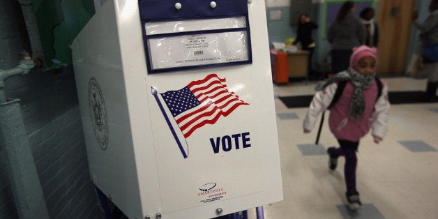 NEW YORK, NY - NOVEMBER 05: A voting booth stands at the ready as students return to school on November 5, 2012 in the East