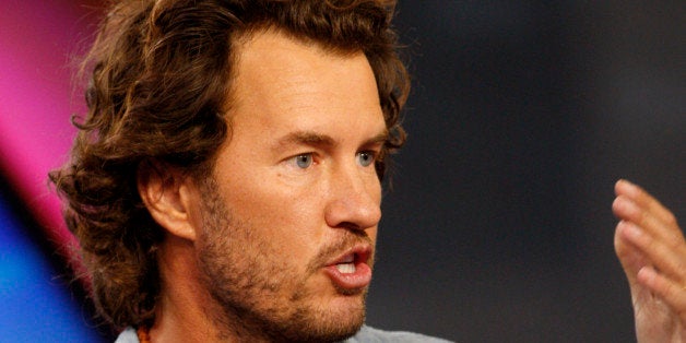 Blake Mycoskie, chief executive officer of TOMS Shoes Inc., speaks during a Bloomberg Television interview in New York, U.S.,
