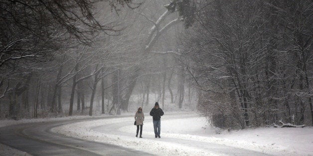 NEW YORK, NY - MARCH 08: People walk through a snow-shrouded park on March 8, 2013 in the Brooklyn borough of New York City.