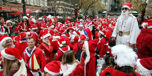 NEW YORK - DECEMBER 11: Hundreds of Santas stand in Herald Square while participating in the 2004 Santacon December 11, 2004 in New York City. The annual event occurs worldwide with hundreds of Santas in New York wandering through the city's bars, subways and tourist sites while generally wreaking havoc and speading holiday cheer. (Photo by Mario Tama/Getty Images)