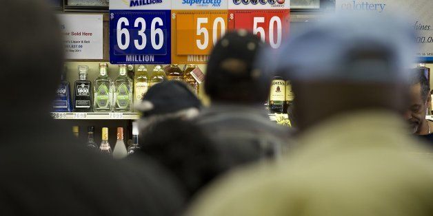 Patrons wait to buy Mega Millions lottery tickets at Lichines Liquor & Deli in Sacramento, Ca., on Tuesday, Dec. 17, 2013. The jackpot has soared to $636 million for Tuesday night's drawing. (Randall Benton/Sacramento Bee/MCT via Getty Images)