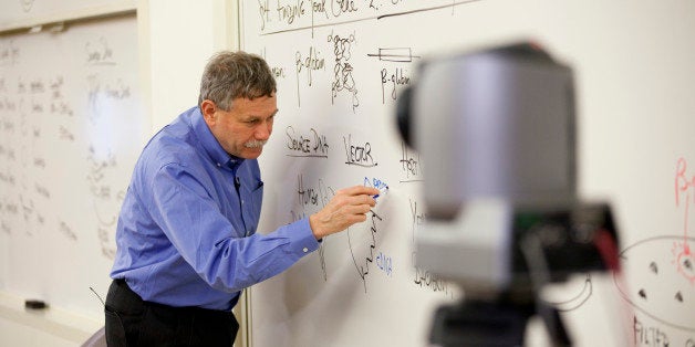 CAMBRIDGE, MA - APRIL 2: Professor Eric Lander is videotaped while he teaches an introduction to biology class at MIT, Massachusetts Institute of Technology, for online learning purposes, on April 2, 2013 in Cambridge, Massachusetts. Three cameras are used: one camera is manned, the other two are remotely controlled. Lander is the pioneering professor who had the idea for the human genome project. The video is produced by edX, a company that was started in conjunction with Harvard and MIT to produce videos for online learning. (Photo by Melanie Stetson Freeman/The Christian Science Monitor via Getty Images)