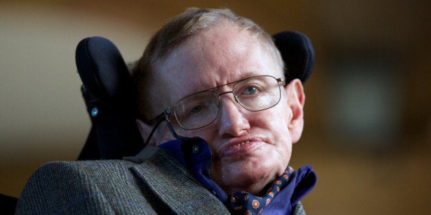 Theoretical physicist Stephen Hawking poses for a picture ahead of a gala screening of the documentary 'Hawking', a film about the scientist's life, at the opening night of the Cambridge Film Festival in Cambridge, eastern England on September 19, 2013. Hawking tells the extraordinary tale of how he overcame severe disability to become the most famous living scientist in a new documentary film premiered in Britain. AFP PHOTO / ANDREW COWIE (Photo credit should read ANDREW COWIE/AFP/Getty Images)