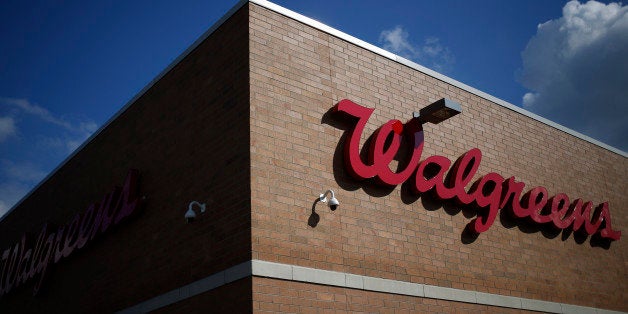 Walgreen Co. signage is displayed outside one of the company's stores in Louisville, Kentucky, U.S., on Monday, Sept. 30, 201