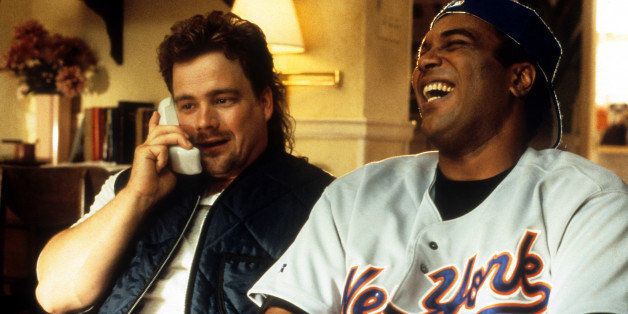 John G Brennan makes a call as Kamal Ahmed laughs in a scene from the film 'The Jerky Boys', 1995. (Photo by Buena Vista/Getty Images)