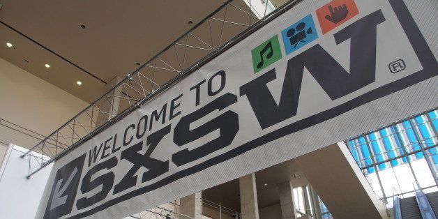 Banners hang in the atrium of the Austin Convention Center on Thursday, March 7, 2012 on the eve of the opening of the 27th South By Southwest (SXSW) interactive, film and music festival. The 10-day event is a magnet for thousands of technology innovators, independent film-makers and up-and-coming musical performers. AFP PHOTO / Robert MacPherson (Photo credit should read Robert MacPherson/AFP/Getty Images)