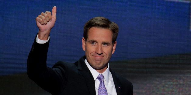 Delaware Attorney General Beau Biden, son of U.S. Vice President Joseph Biden, gestures while arriving to speak on day three of the Democratic National Convention (DNC) in Charlotte, North Carolina, U.S., on Thursday, Sept. 6, 2012. President Barack Obama's prime-time nomination acceptance speech tonight at the DNC will be aimed at convincing voters that a slow economic recovery will accelerate if they give him a second term. Photographer: Scott Eells/Bloomberg via Getty Images 
