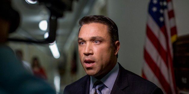 WASHINGTON, DC - APRIL 29: Congressman Michael Grimm (R-NY), whose been indicted on 20-counts of federal fraud, is back to lawmaking in Washington DC speaks to reporters outside his Capitol Hill office, Tuesday, April 29, 2014. Rep. Grimm was released on $400,000 bond from police custody. (Photo by Melina Mara/The Washington Post via Getty Images)