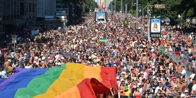 SAO PAULO, BRAZIL - MAY 04: Over a million people flooded the streets of central Sao Paulo this Sunday as the city's 18th annual Gay Pride Parade rode into town, with color, music and exotic fancy dress in Sao Paulo, Brazil on May 4, 2014. This year's parade called for the criminalization of discrimination of members of the LGBT (lesbian, gay, bisexual, transgender) community, as well as the approval of the Gender Identity Bill, guaranteeing simplified legal recognition of transgendered people. As many as 400,000 tourists, both Brazilian and foreign, are thought to have come to Brazil's biggest city for the event, which is funded in large part by the local government and state companies. (Photo by Ben Tavener/Anadolu Agency/Getty Images)