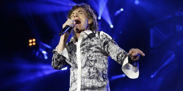 Mick Jagger of the Rolling Stones performs during a concert in the Telenor Arena at Fornebu in Baerum just south of Oslo on May 26, 2014. The Rolling Stones resume their world tour in Oslo, interrupted more than two months ago due to the suicide of Mick Jagger's partner. Oslo is the first European stop of the '14 on Fire Tour', and the show has caused a frenzy among the legendary's band's Norwegian fans with the 25,000 tickets selling out in just 13 minutes. AFP PHOTO / NTB SCANPIX / TERJE BENDIKSBY +++ NORWAY OUT +++ (Photo credit should read TERJE BENDIKSBY/AFP/Getty Images)