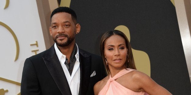 Actrors Will Smith and Jada Pinkett Smith arrive on the red carpet for the 86th Academy Awards on March 2nd, 2014 in Hollywood, California. AFP PHOTO / Robyn BECK (Photo credit should read ROBYN BECK/AFP/Getty Images)