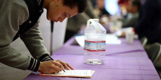 SAN FRANCISCO, CA - MAY 21: A job seeker fills out an application during a career fair at the Southeast Community Facility Commission on May 21, 2014 in San Francisco, California. Job seekers came out in force looking for employment from nearly 40 employers at the second annual job and career fair in San Francisco's Bayview district. California's unemployment fell to 7.8 percent in April, down from 9.1 percent in April of 2013. (Photo by Justin Sullivan/Getty Images)