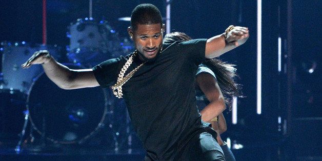 LOS ANGELES, CA - JUNE 29: Singer Usher performs onstage during the BET AWARDS '14 at Nokia Theatre L.A. LIVE on June 29, 2014 in Los Angeles, California. (Photo by Kevin Winter/Getty Images for BET)