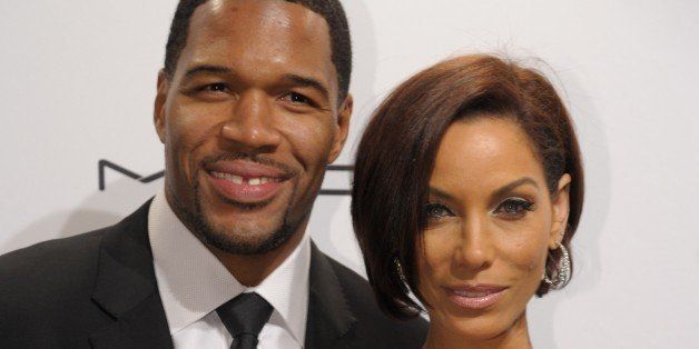 Michael Strahan (L) and Nicole Murphy (R) arrive at the amfAR (The Foundation for AIDS Research) gala that kicks off the Mercedes-Benz Fashion Week February 6, 2013 in New York. AFP PHOTO/Stan HONDA (Photo credit should read STAN HONDA/AFP/Getty Images)