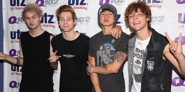 BALA-CYNWYD, PA - AUGUST 13: (L-R) Michael Clifford, Luke Hemmings, Calum Hood and Ashton Trwin of 5 Seconds of Summer pose at Q102 Performance Theater August 13, 2014 in Bala Cynwyd, Pennsylvania. (Photo by Bill McCay/WireImage)