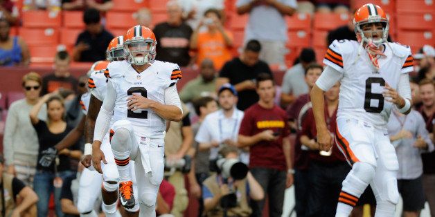 LANDOVER, MD - AUGUST 18: Quarterbacks Johnny Manziel #2 and Brian Hoyer #6 of the Cleveland Browns warm up before the start of a preseason football game against the Washington Redskins at FedExField on August 18, 2014 in Landover, Maryland. (Photo by TJ Root/Getty Images) 