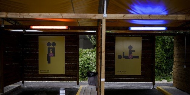 Two empty so-called 'sex boxes' are seen at the opening day of Switzerland's first sex drive-in on August 26, 2013 in Zurich, which is aiming to get prostitution off the city streets. The drive-in, which as darkness began to fall was bathed in colorful lights, has a track where the sex workers can show off their assets and negotiate a price, and nine so-called 'sex boxes' where they and their clients can park and conclude the transaction. AFP PHOTO / FABRICE COFFRINI (Photo credit should read FABRICE COFFRINI/AFP/Getty Images)