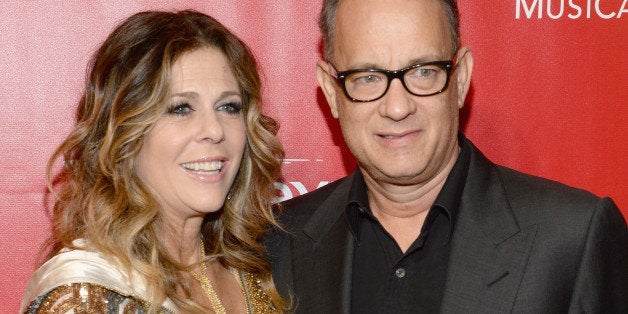 LOS ANGELES, CA - JANUARY 24: Actors Rita Wilson (L) and Tom Hanks attend 2014 MusiCares Person Of The Year Honoring Carole King at Los Angeles Convention Center on January 24, 2014 in Los Angeles, California. (Photo by Larry Busacca/WireImage)