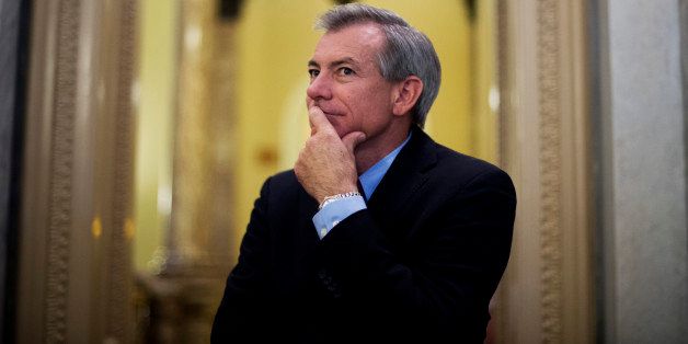 UNITED STATES - SEPTEMBER 27: Rep. David Schweikert, R-Ariz., listens to a Senator be interviewed outside the Senate chamber before a vote which passed the continuing resolution. A dozen or so House members came to the Senate to watch the vote. (Photo By Tom Williams/CQ Roll Call)