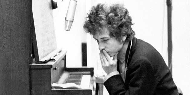 NEW YORK - SUMMER 1965: Bob Dylan plays piano with a harmonica around his neck during the recording of the album 'Highway 61 Revisited' in Columbia's Studio A in the summer of 1965 in New York City, New York. (Photo by Michael Ochs Archives/Getty Images)