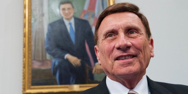 UNITED STATES - JULY 29: Rep. John Mica, R-Fla., poses in front of his portrait in the House Committee on Transportation and Infrastructure Committee room in Rayburn, July 29, 2014. (Photo By Tom Williams/CQ Roll Call)