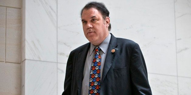 In this Sept. 5, 2013 file photo, Rep. Alan Grayson, R-Fla., arrives to join lawmakers and national security officials at the Capitol for a closed-door briefing on the situation in Syria, in Washington. Grayson issued a statement Wednesday, March 5, 2014 denying he battered his estranged wife. His wife, Lolita, claims he pushed her against the front door of their Orlando home when he stopped by the house to visit his children on Saturday, March 1, 2014. (AP Photo/J. Scott Applewhite, File)