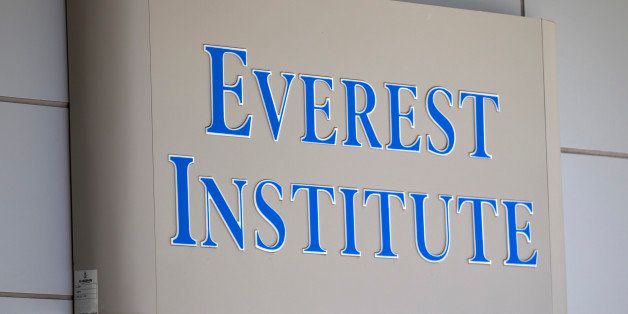 Everest Institute sign is seen in a office building in Silver Spring, Md., Tuesday, July 8, 2014. The dozen campuses that for-profit education company Corinthian Colleges Inc. is closing operate under the Everest name and are scattered in 11 different states, the company announced. (AP Photo/Jose Luis Magana)