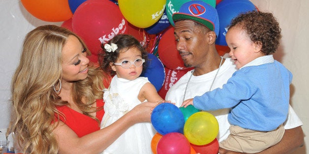 SANTA MONICA, CA - OCTOBER 06: Singer Mariah Carey and TV personality Nick Cannon pose for pictures with their twins Monroe Cannon and Moroccan Scott Cannon during 'Family Day' at Santa Monica Pier on October 6, 2012 in Santa Monica, California. (Photo by Angela Weiss/WireImage)