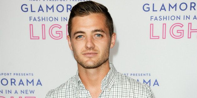 FILE - This Sept. 12, 2013 file photo shows Robbie Rogers at the Macy's Passport's Glamorama at The Orpheum Theatre in Los Angeles. Rogers, the first openly gay male athlete to play in a U.S. professional league, has a memoir scheduled for next year. âComing Out to Playâ will be published as a paperback original by Penguin Books, the publisher announced Thursday, Oct. 10. According to Penguin, Rogersâ book will track his rise from a âtroubled, isolated childâ to a winger for the Los Angeles Galaxy of the Major Soccer League. Rogers, 26, will co-write the book with Eric Marcusm who collaborated on Greg Louganisâ best-selling memoir. (Photo by Richard Shotwell/Invision/AP, File)