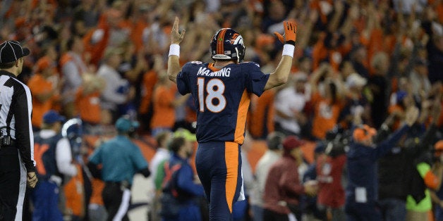 DENVER, CO - OCTOBER 19: Peyton Manning (18) of the Denver Broncos celebrates his 508th touchdown. The Denver Broncos played