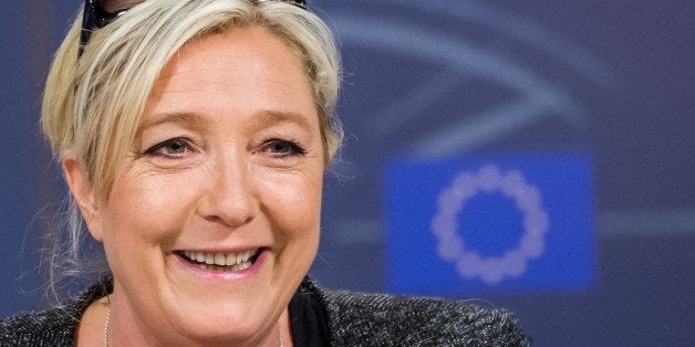 In this picture taken on Wednesday, May 28, 2014, French far-right National Front party leader Marine Le Pen speaks during a media conference after a meeting with other EU far-right parties at the European Parliament in Brussels. Marine Le Pen, the French shock winner in the European elections, has come to the home of the European Union, the organization she blames for undermining France's economy, hamstringing its sovereignty and flooding it with immigrants. The National Front leader was searching Wednesday for enough like-minded fellow members of the European Parliament to form a parliamentary group, a step that would guarantee it more speaking time and allow it to benefit from administrative and financial support. Le Penâs party came out on top in Sundayâs elections, and will be sending Franceâs largest contingent to the European Parliament. (AP Photo/Geert Vanden Wijngaert)