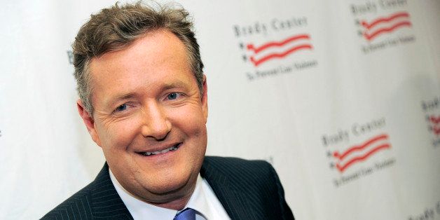 FILE - This May 7, 2013 file photo shows Piers Morgan at the Brady Campaign to Prevent Gun Violence Los Angeles Gala in Beverly Hills, Calif. â Morgan has a deal with Gallery Books for "Shooting Straight: Guns, Gays, God, and George Clooney." Gallery, an imprint of Simon & Schuster, announced Wednesday, May 22, that the book is scheduled for October. (Photo by Chris Pizzello/Invision/AP, file)