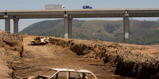 The frames of cars are revealed by the receding water line in the Atibainha dam, part of the Cantareira System that provides