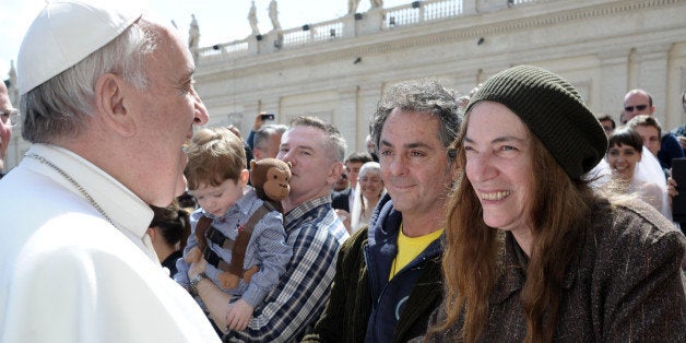 US artist Patti Smith, right, is greeted by Pope Francis at the end of his weekly general audience, in St. Peter's Square at