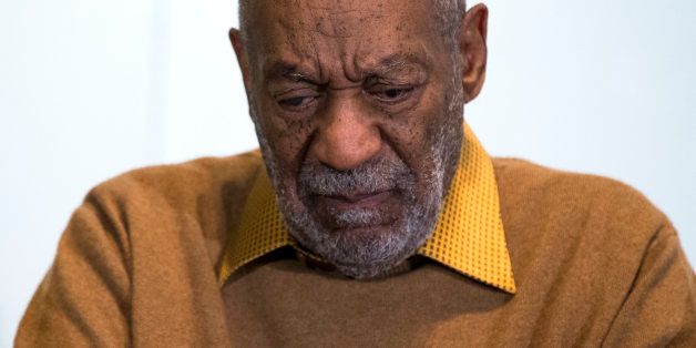 In this photo taken Nov. 6, 2014, entertainer Bill Cosby pauses during a news conference about the upcoming exhibit, Conversations: African and African-American Artworks in Dialogue, at the Smithsonian's National Museum of African Art in Washington. The Smithsonian Institution is mounting a major showcase of African-American art and African art together in a new exhibit featuring the extensive art collection of Bill and Camille Cosby. More than 60 rarely seen African-American artworks from the Cosby collection will join 100 pieces of African art at the National Museum of African Art. The exhibit âConversations: African and African American Artworks in Dialogue,â opens Sunday and will be on view through early 2016. (AP Photo/Evan Vucci)