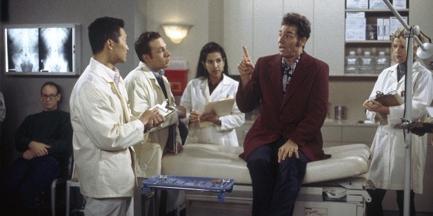 SEINFELD -- 'The Burning' Episode 16 -- Pictured: (l-r) Daniel Dae Kim as Student, (second from right) Michael Richards as Cosmo Kramer -- Photo by: Joey Delvalle/NBCU Photo Bank 