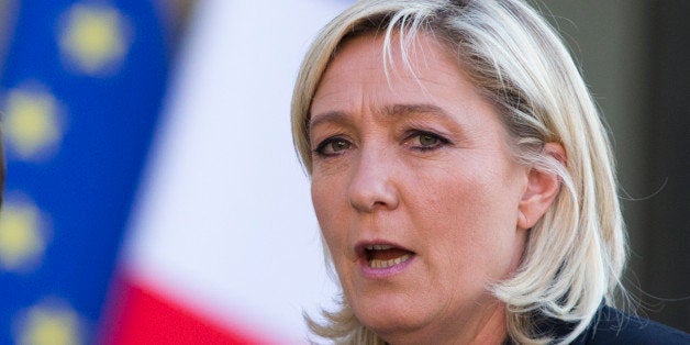 French far-right Front National party president Marine Le Pen talks to the media at the end of the meeting with French President Francois Hollande at the Elysee Palace, on Friday May 16, 2014 in Paris. (AP Photo/Jacques Brinon)